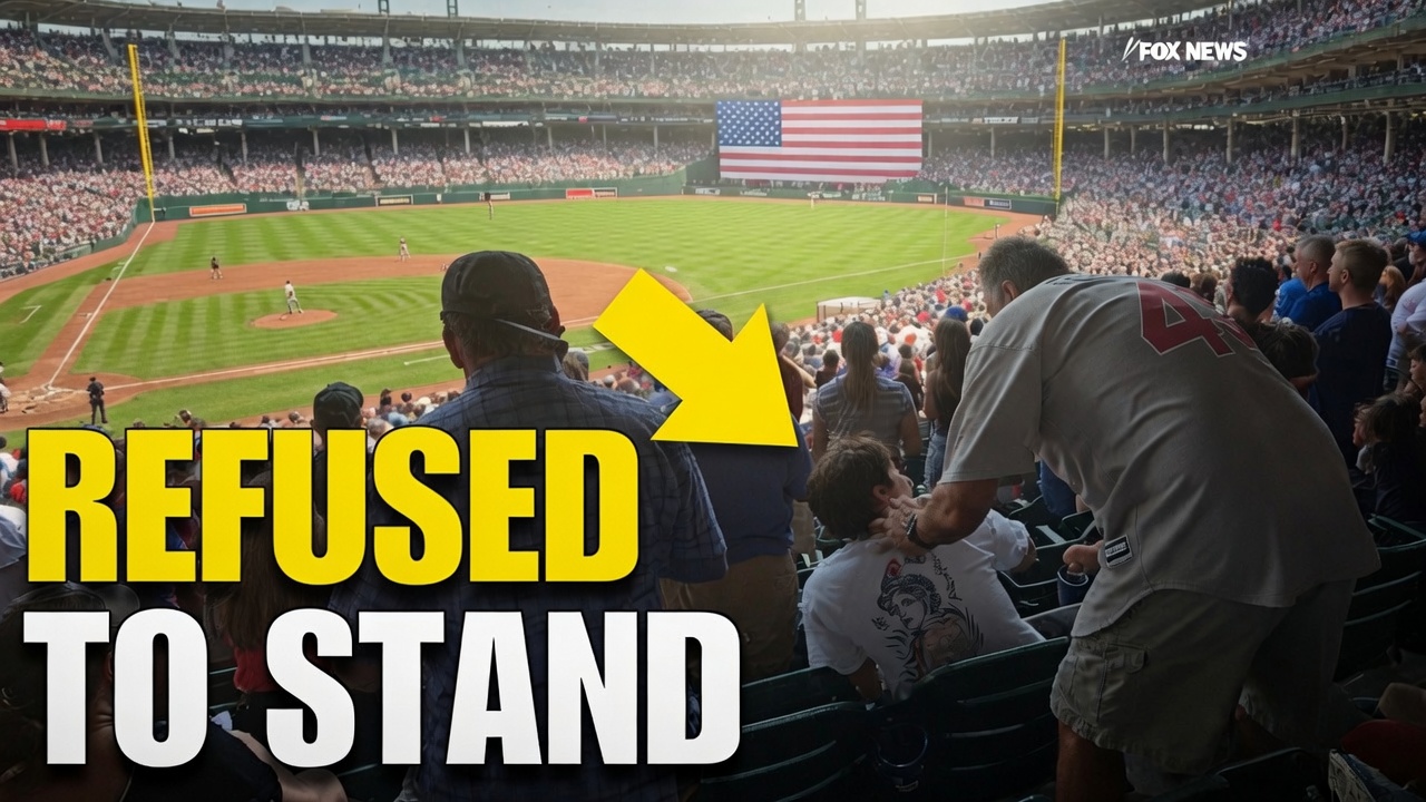 Fan Smacked for Not Standing During National Anthem – Who Was Right?